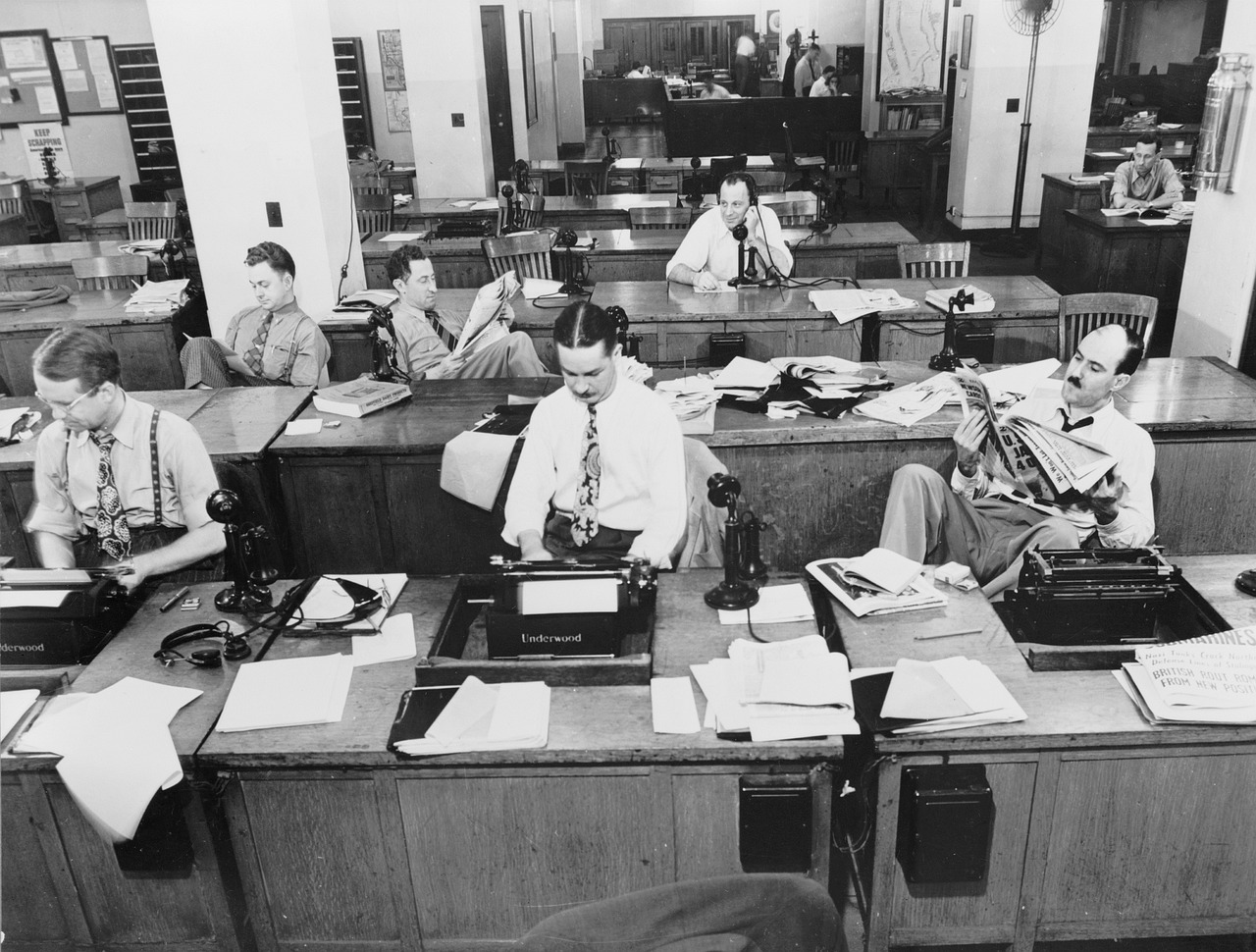 newsroom journalists camera